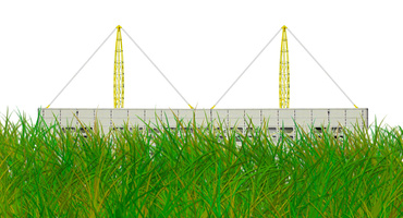 Fábrica de igus detrás de la hierba