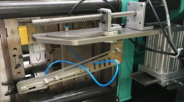 extractor de coladas en máquinas de inyección